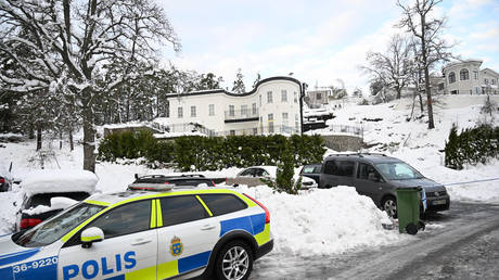 A police car is parked near a house where the Swedish Security Service allegedly arrested two people in Stockholm on November, 22 2022.