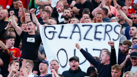 Manchester United fans wave anti-Glazer banners in the stands during a Premier League match at Old Trafford