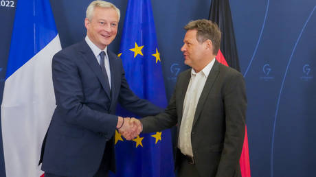 German Minister of Economics and Climate Protection Robert Habeck shakes hands with French Economy Minister Bruno Le Maire on March 31, 2022.