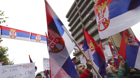 Kosovo Serbs wave Serbian flags during a protest in Mitrovica, Kosovo, Sunday, Nov. 6, 2022