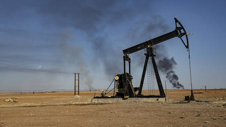 A smoke rises from an oil depot struck by Turkish air force near the town of Qamishli, Syria, November 23, 2022