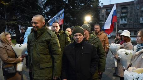 Russian soldiers return home after prisoner swap