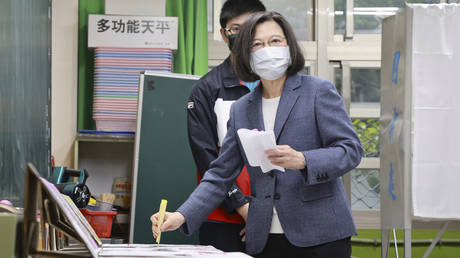 Taiwan President Tsai Ing-wen casts her ballots at a polling station in New Taipei City, Taiwan, November 26, 2022
