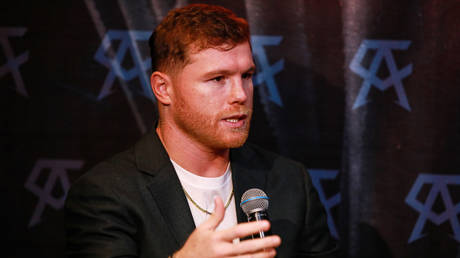Boxer Canelo offers apologies after Messi threat