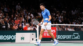 Djokovic wins to set up Russian clash