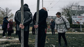 Ukrainians tie ‘collaborators’ to poles in Kherson