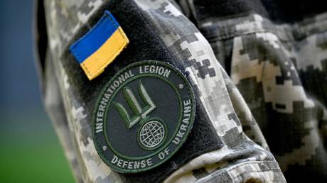 The insigna of the International Legion for the Defence of Ukraine (LIDU) on the jacket of LIDU's spokesman in the Ukrainian capital Kyiv.