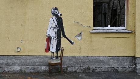 A graffiti made by Banksy on the wall of a damaged building in the town of Gostomel.