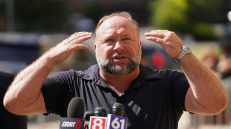 File photo: InfoWars founder Alex Jones speaks to the media during his trial in Connecticut, September 21, 2022