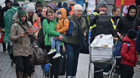 FILE PHOTO: Ukrainian refugees are shown arriving at Poland's Medyka border crossing.