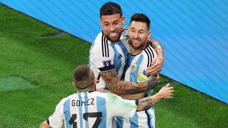 Messi scores in landmark match as Argentina advance