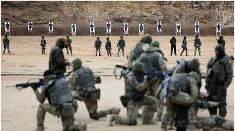 FILE PHOTO: Ukrainian soldiers at a shooting range in Toledo, Spain, December 2, 2022.