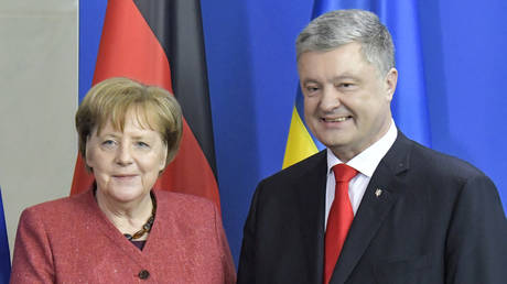 FILE PHOTO. Angela Merkel and Pyotr Poroshenko meet in 2019.