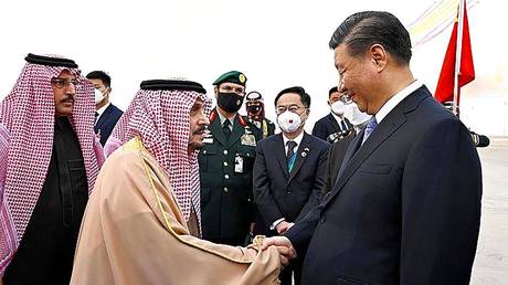 Chinese President Xi Jinping, right, shakes hands with Prince Faisal bin Bandar bin Abdulaziz, Governor of Riyadh, after his arrival in Riyadh, Saudi Arabia, Wednesday, Dec. 7, 2022.