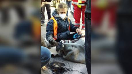 Police remove a climate activist from a street in Mainz, Germany, December 9, 2022