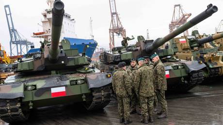 FILE PHOTO. Polish Army soldiers stand in front of tanks in Gdynia.