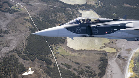 A Swedish Air Force Jas 39 Gripen E jet fighter flies over Gotland Island in the Baltic Sea on May 11, 2022.