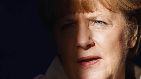 File - German Chancellor Angela Merkel is pictured with light and shadow at the Meseberg palace near Berlin, Germany, Thursday, Jan. 23, 2014.
