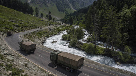 FILE PHOTO. An Indian army convoy drives towards Leh, on a highway bordering China in Gagangir, India.