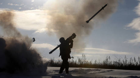 FILE PHOTO. A Ukrainian soldiers fires a missile with a man-portable air-defense system during exercices.