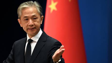 FILE PHOTO: Chinese Foreign Ministry spokesman Wang Wenbin gestures during a press conference at the Ministry of Foreign Affairs in Beijing, China.