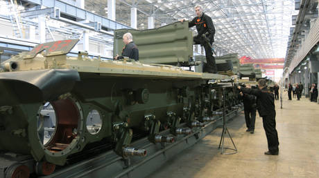 FILE PHOTO: Workers assemble tanks on the production floor at the Uralvagonzavod plant in Russia's Urals.
