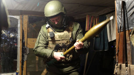 FILE PHOTO: A serviceman of Ukrainian Military Forces holds a hand grenade launcher.