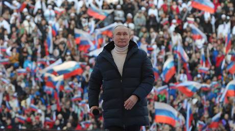 Russian President Vladimir Putin attends a concert marking the eighth anniversary of Russia's annexation of Crimea at the Luzhniki stadium in Moscow on March 18, 2022.