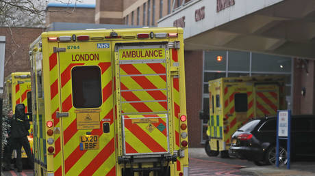 FILE PHOTO: Ambulances are parked at the emergency arrival at Charing Cross hospital in London, January 8, 2021