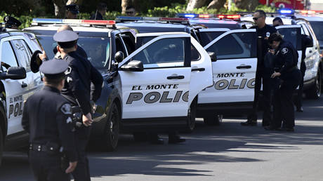 FILE PHOTO: Police officers attend a memorial service in Ontario, California, 2022.