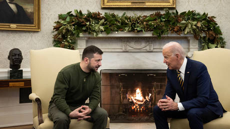 US President Joe Biden and Ukraine's President Volodymyr Zelensky meet in the Oval Office of the White House, in Washington, DC on December 21, 2022.