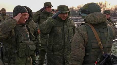 Russian Defense Minister Sergei Shoigu inspects positions of troops in an unknown location of the military operation in Ukraine.