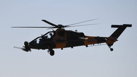 FILE PHOTO: A Turkish military helicopter in the air above Syria.