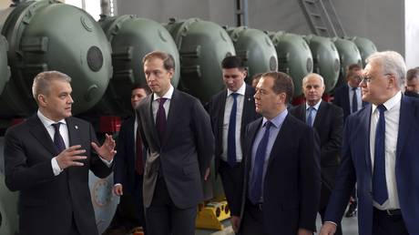 FILE PHOTO: Dmitry Medvedev visits the Avangard plant in Moscow, Russia, October 7, 2022