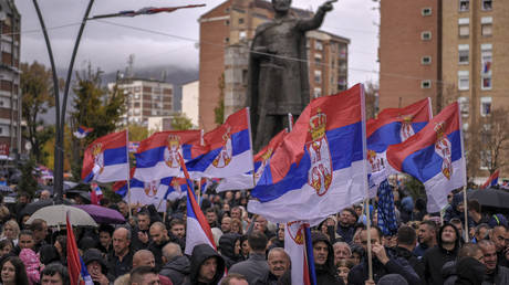Kosovo Serbs wave Serbian flags during a protest in the Serb predominant part of Mitrovica on November 6, 2022.