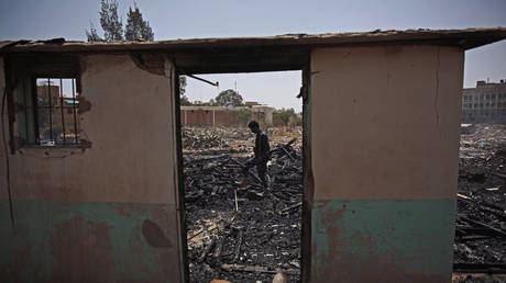 FILE - A Yemeni soldier inspects a site of Saudi-led airstrikes targeting two houses in Sanaa, Yemen, March 26, 2022.