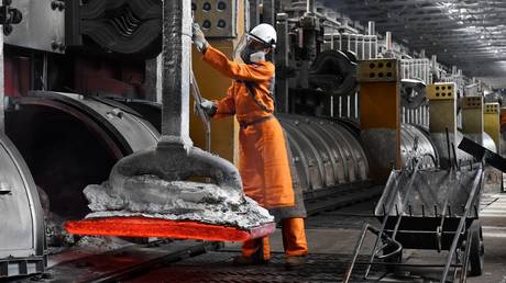 An employee works at the electrolysis shop of the Rusal Krasnoyarsk aluminium smelter in Krasnoyarsk, Russia.