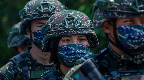 FILE PHOTO: Taiwanese military personnel stand in a line during the Han Kuang military exercise.