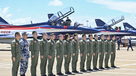People's Liberation Army pilots line up ahead of an airshow in Guangdong