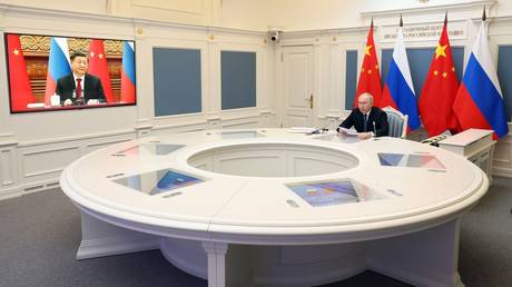 Russian President Vladimir Putin holds a meeting with Chinese President Xi Jinping via video conference at the Kremlin in Moscow, Russia.