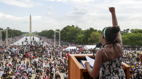 FILE - In this Friday, Aug. 28, 2020, file photo, Yolanda Renee King, granddaughter of the Rev. Martin Luther King Jr., raises her fist as she speaks during the March on Washington, on the 57th anniversary of the Rev. Martin Luther King Jr.'s "I Have A Dream" speech.