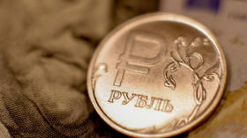 Ruble slides to April low against dollar