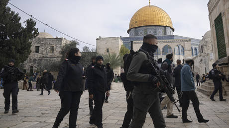 Israeli police escort Jewish visitors to the Al-Aqsa Mosque compound in Jerusalem, January 3, 2023