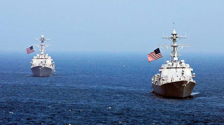 FILE PHOTO: The USS Chung-Hoon (right) and USS Lassen guided-missile destroyers operate in waters east of the Korean Peninsula in July 2010.