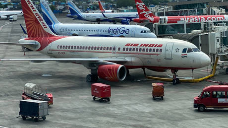 FILE PHOTO: An Air India aircraft is seen at a terminal of the Mumbai airport in India, October 9, 2021.