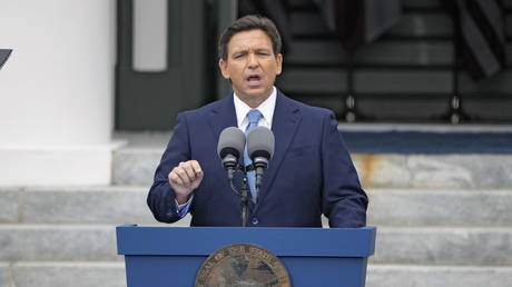 Florida governor takes immigration swipe at Biden