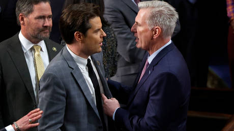 US Representative Kevin McCarthy (right) talks to fellow Republican Matt Gaetz while seeking votes to become House speaker on Friday at the Capitol in Washington.