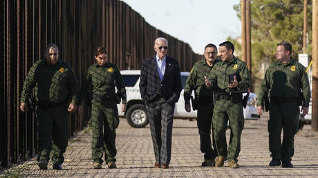 President Joe Biden walks with US Border Patrol agents along a stretch of the US-Mexico border in El Paso, Texas, January 8, 2023