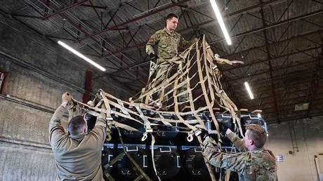 FILE PHOTO: US Air Force personnel prepare to military equipment crates bound for Ukraine at the Dover Air Force Base, US, on April, 24, 2022.