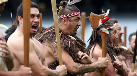 Maori warriors perform a traditional haka dance.